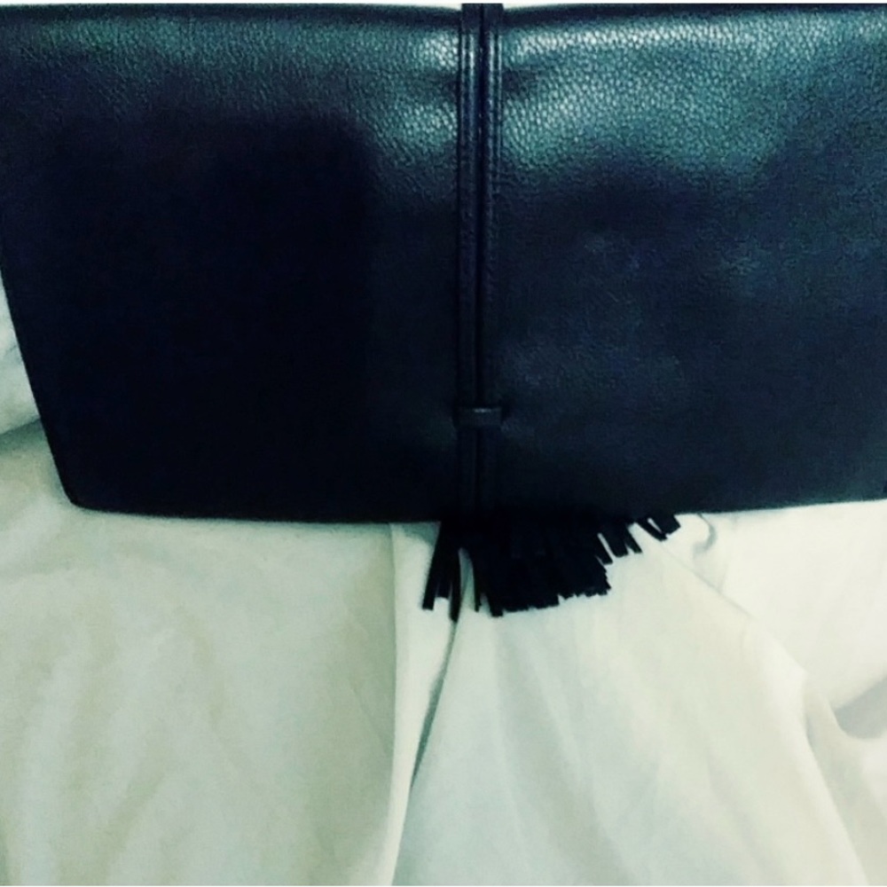 Unbranded Clutch Purse, w/ fold over snap closure and has decorative tassels